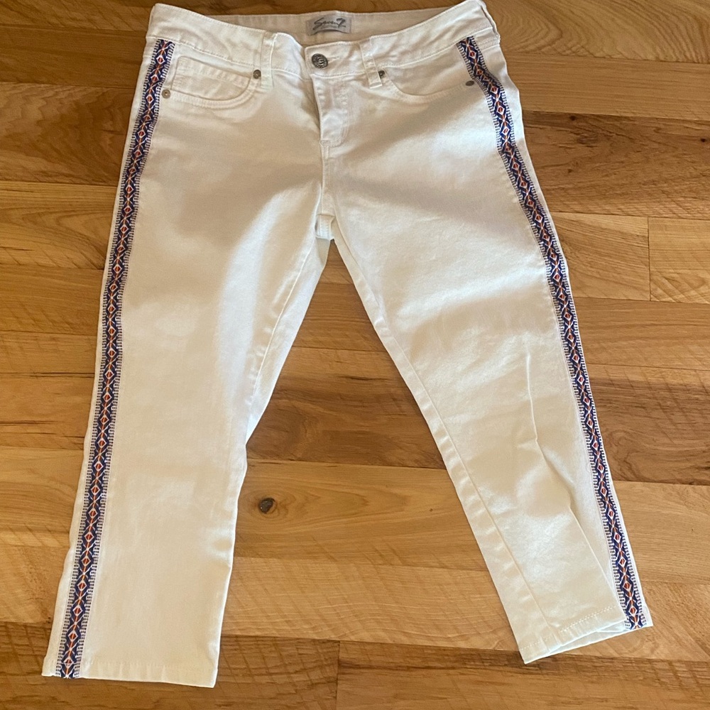 White capris with embroidered leg stripe